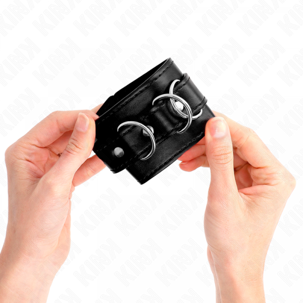 img_189182_79e1f7c0d8f5bb9f0d05f5ea71e58e8f_1.png KINK - MUÑEQUERAS CON 3 ANILLAS EN D AJUSTABLE NEGRO 17.5-25 CM X 6 CM
