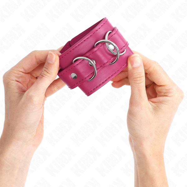 img_189189_7b52deb337d0b6e985cbaa351eb6d92a_1.png KINK - MUÑEQUERAS CON 3 ANILLAS EN D AJUSTABLE ROSA 17.5-25 CM X 6 CM