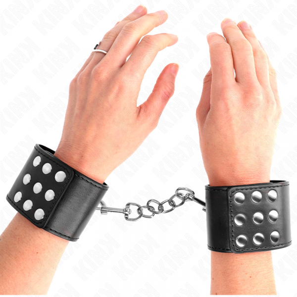 img_189197_f06ba43f262e307d08239bab6e4ea20e_1.png KINK - MUÑEQUERAS CON CIERRE A PRESIÓN AJUSTABLE NEGRO 19-24 CM X 5.5 CM