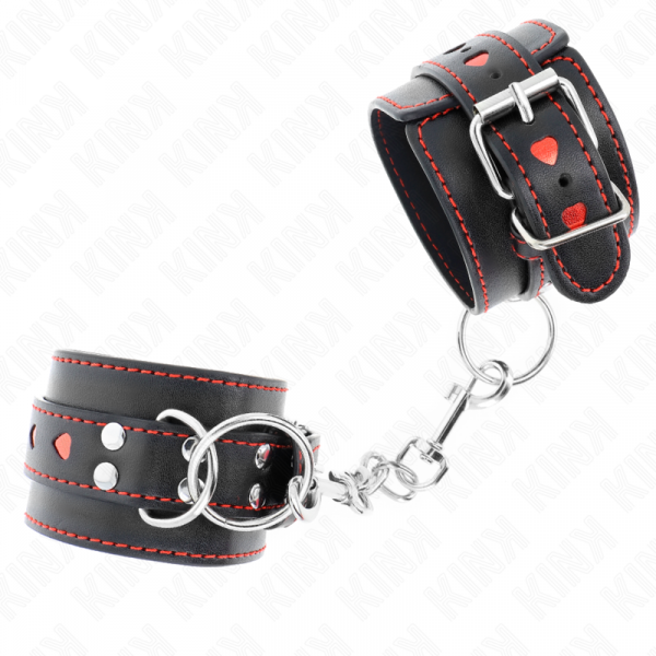 img_189444_fb98439450d16c54e6a8afcd4fac2a65_1.png KINK - MUÑEQUERAS NEGRO CON INCRUSTACIÓN DE CORAZÓN ROJO AJUSTABLE 21-28 CM X 5.5 CM